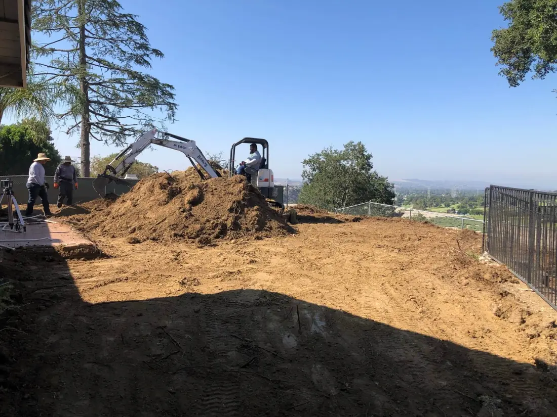 Agoura Hills 2 Excavator clearing a hillside backyard lot for a new pool