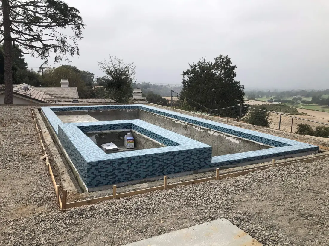 Malibu 2 Glass mosaic tile going onto a new pool and spa shell during construction
