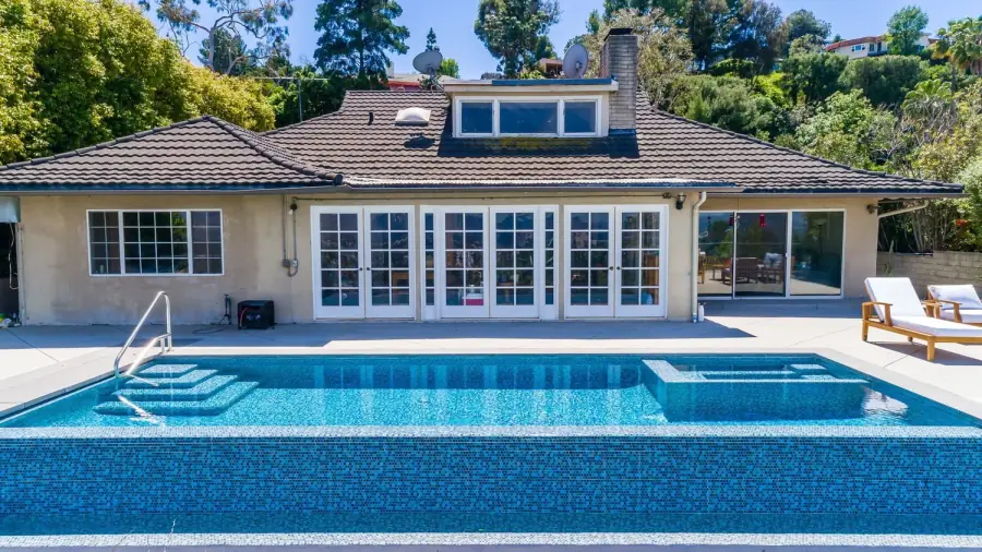 Finished infinity-edge pool with a view on a Los Angeles hillside lot