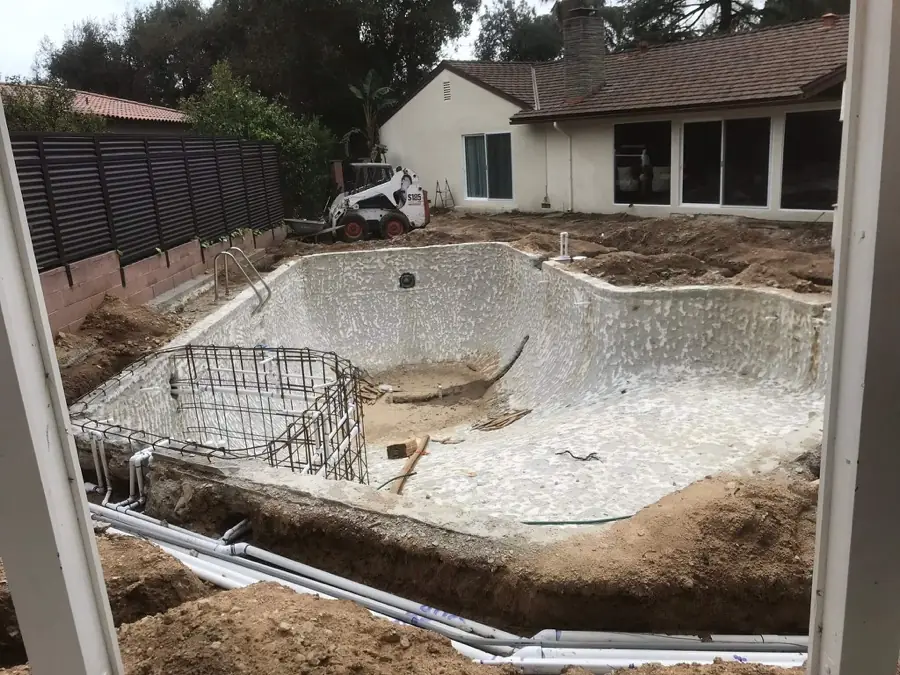 Los Angeles 2 Pool shell stripped to gunite during a full renovation, with new plumbing lines run around the deck