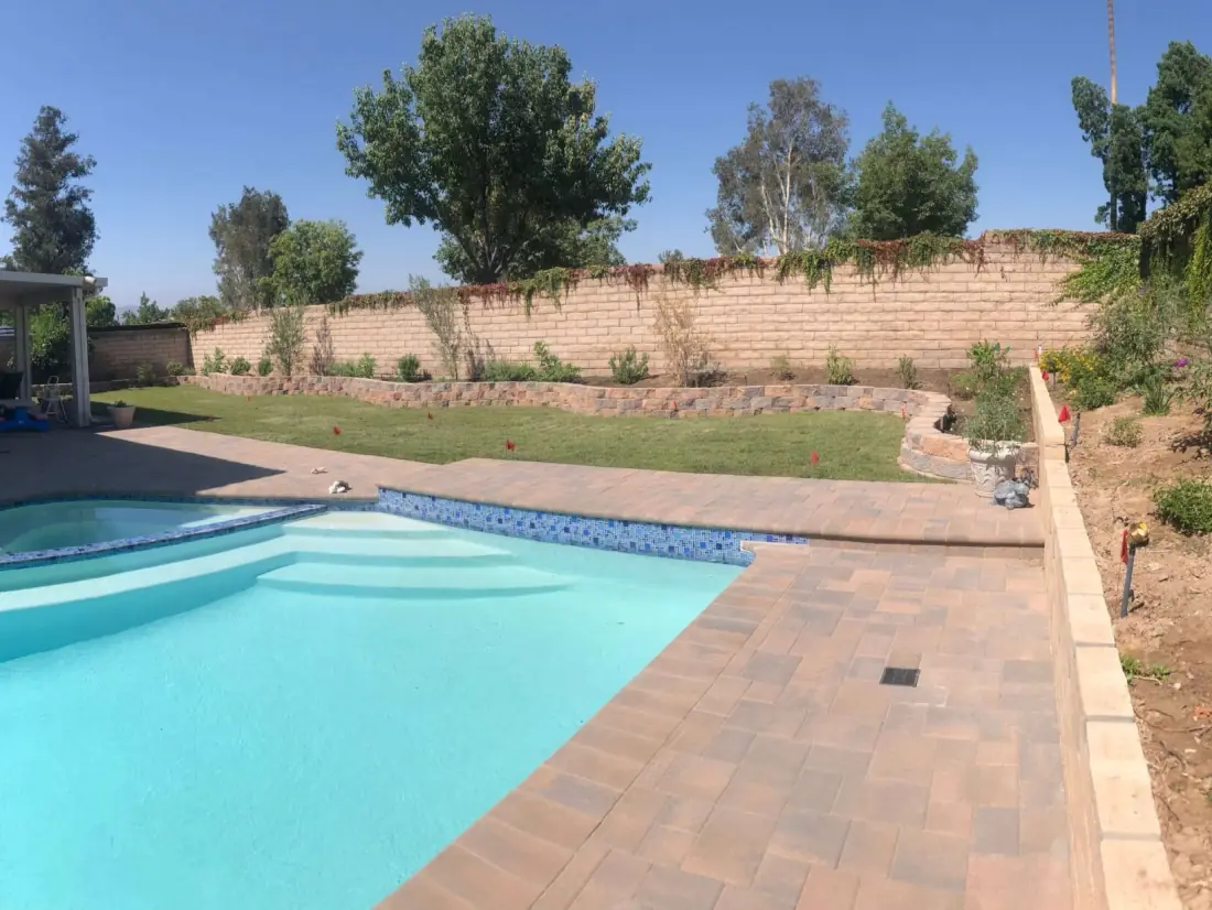 Winnetka 1 Rectangular pool with a paver deck along a planted slope