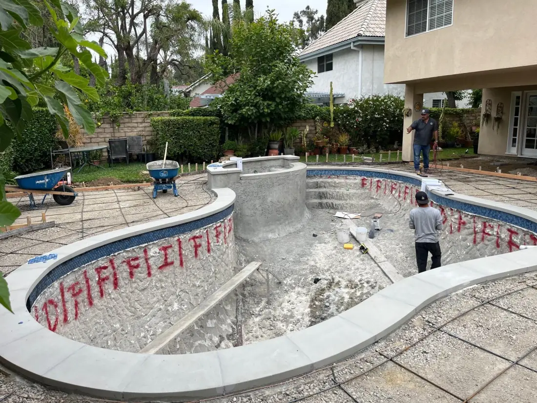 For Pool Service Techs and Leak Detection Companies 1 New raised spa being built inside an existing freeform pool during a remodel