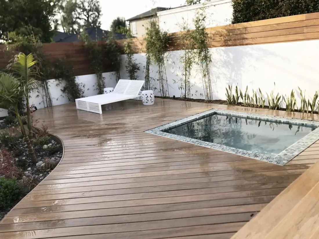 Pacific Palisades 1 Tiled spa set into a new hardwood deck with a lounge chair